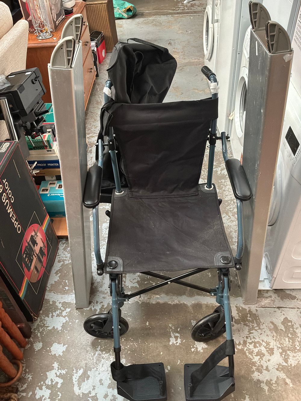 Lot 420: A Drive DeVilbiss Healthcare Travelite folding transport wheelchair and a pair of Patterson Medical Axcess telescopic wheelchair ramps