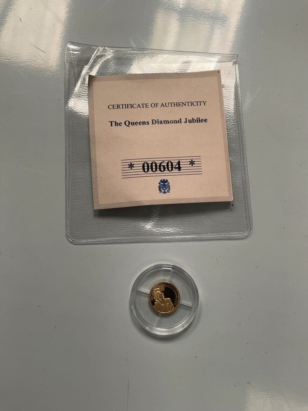 Lot 117: UK 2012 Queen Elizabeth II Diamond Jubilee 0.5g 14ct Gold Commemorative Strike
