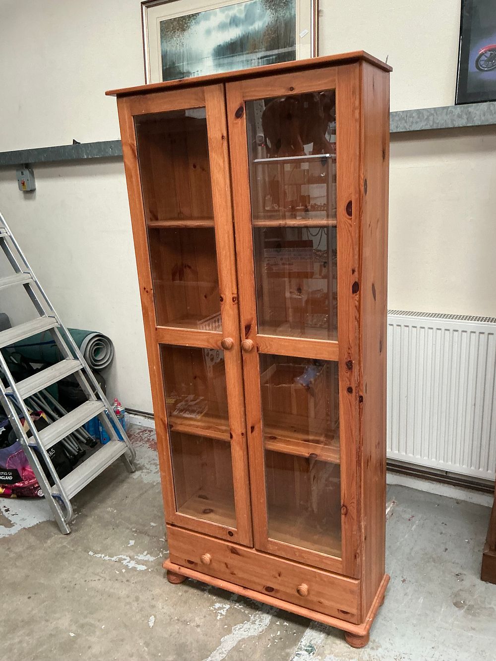 Lot 442: A modern solid pine glazed display cabinet