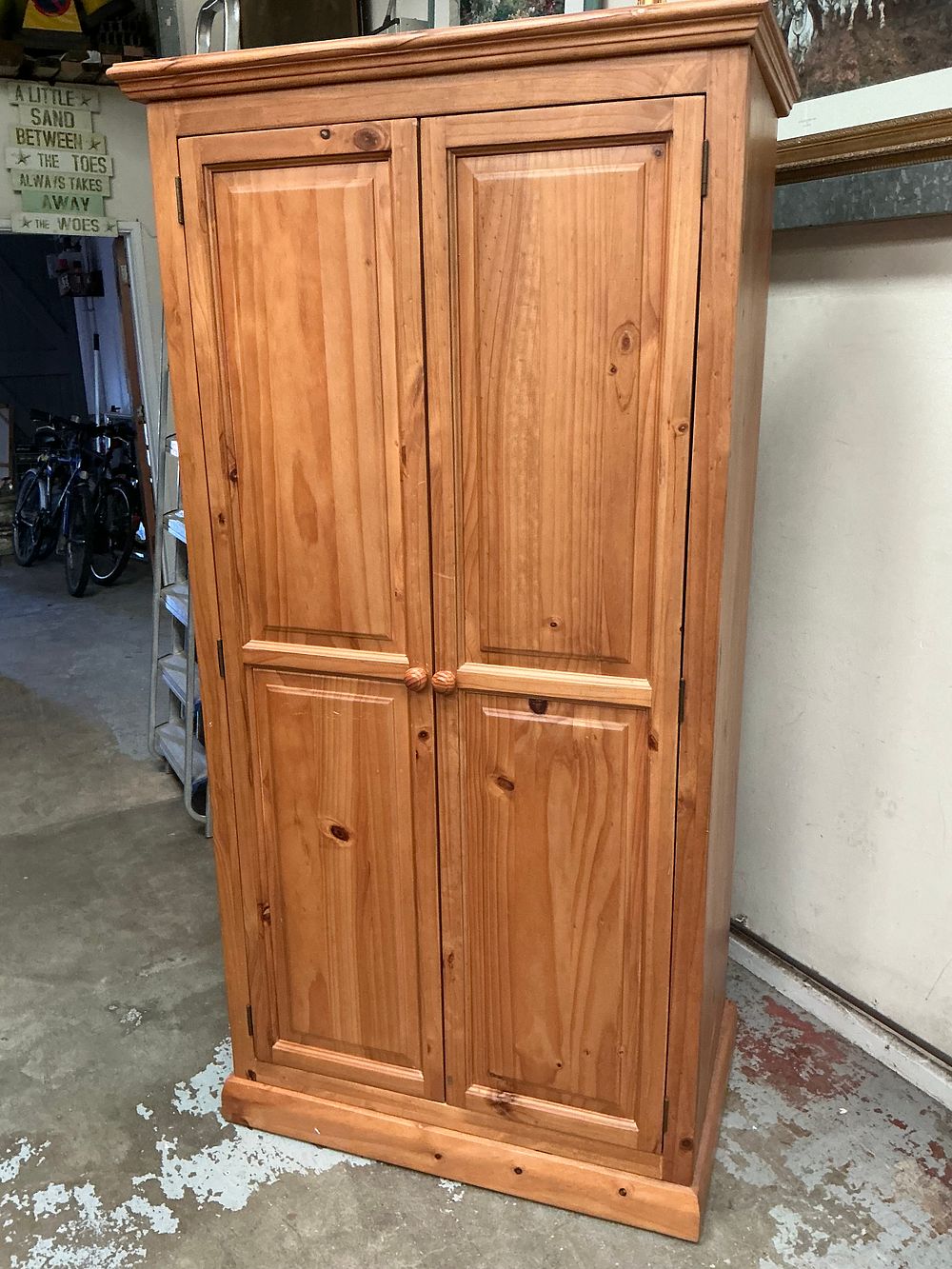 Lot 455: A Large Solid Pine Traditional Double-Door Armoire