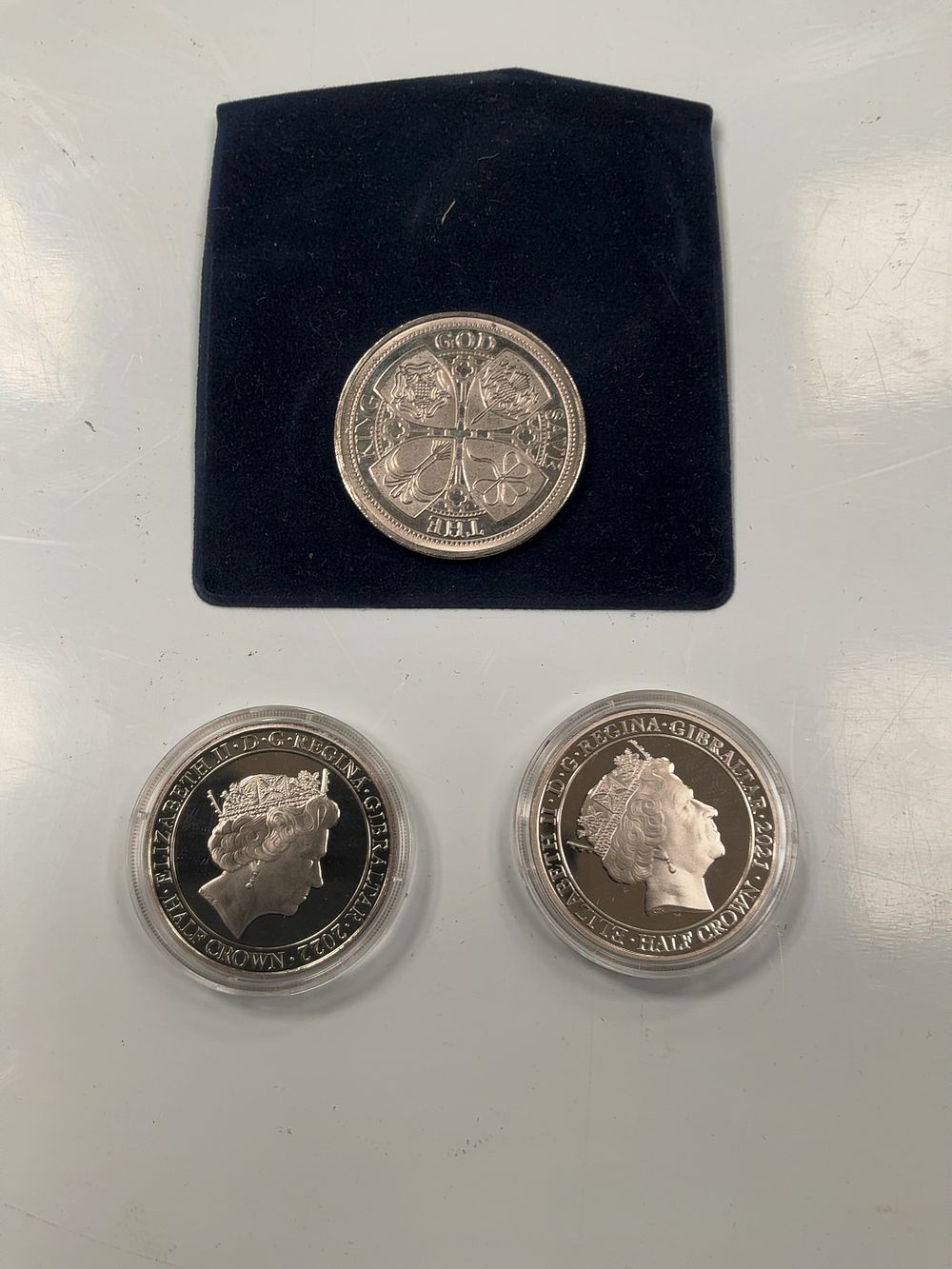 Lot 77: Three Commemorative Numismatic Items Including Two GIB Half Crowns and One Medallion