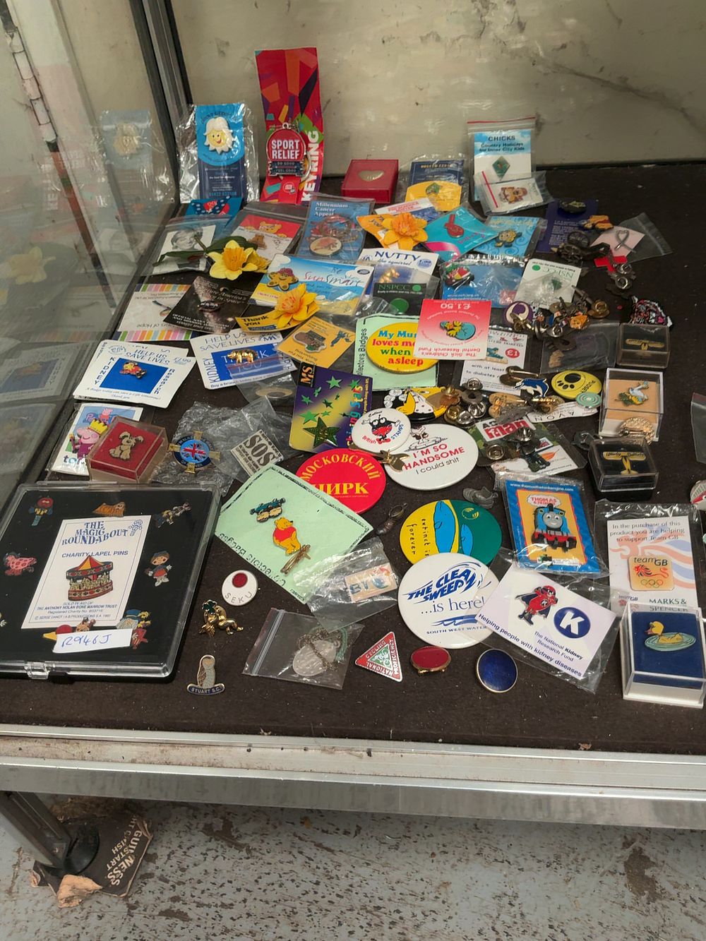 Lot 84: An Assortment of Vintage and Contemporary Lapel Pins and Button Badges featuring Charity and Character Themes