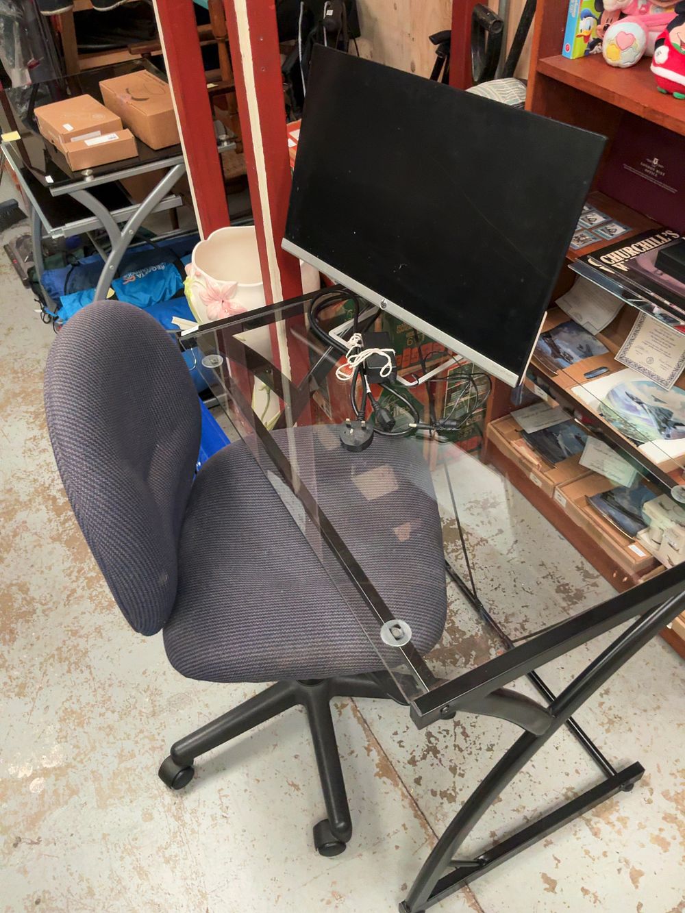 Lot 97: A Modern Home Office Furniture Set Comprising a Glass-Topped Desk, HP Monitor, and Swivel Chair