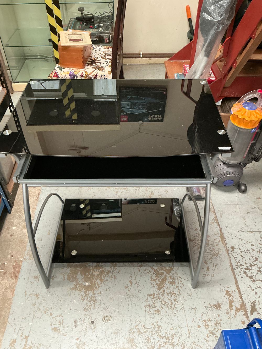 Lot 156: A contemporary black tempered glass and silver-toned metal computer desk