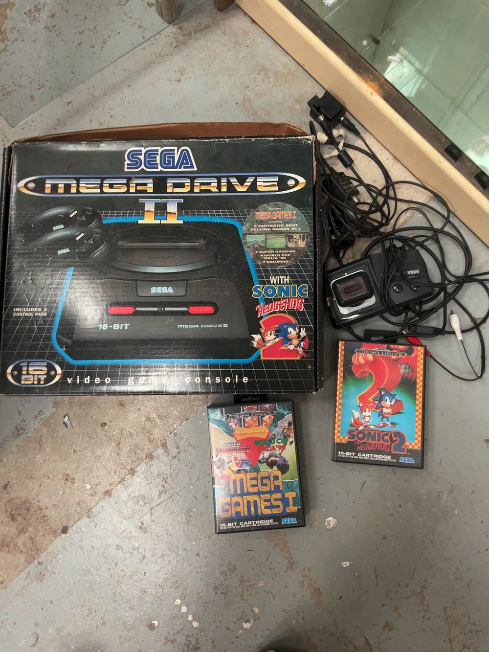 Lot 167: Sega Mega Drive II 16-Bit Console Bundle with Original Packaging and Games