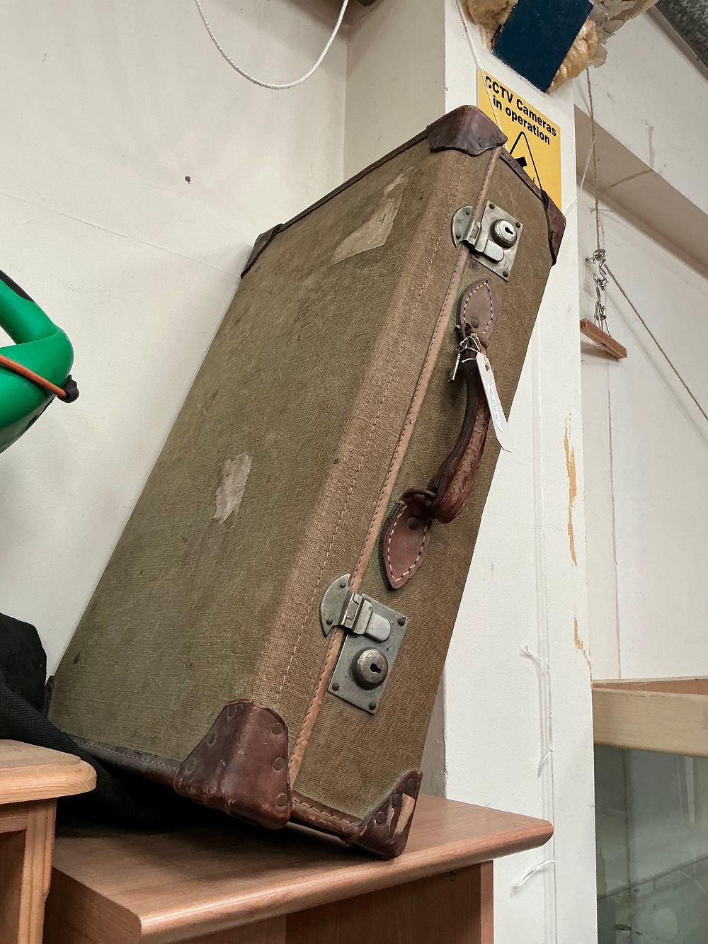 Lot 175: A Mid-20th Century Canvas and Leather-Bound Suitcase