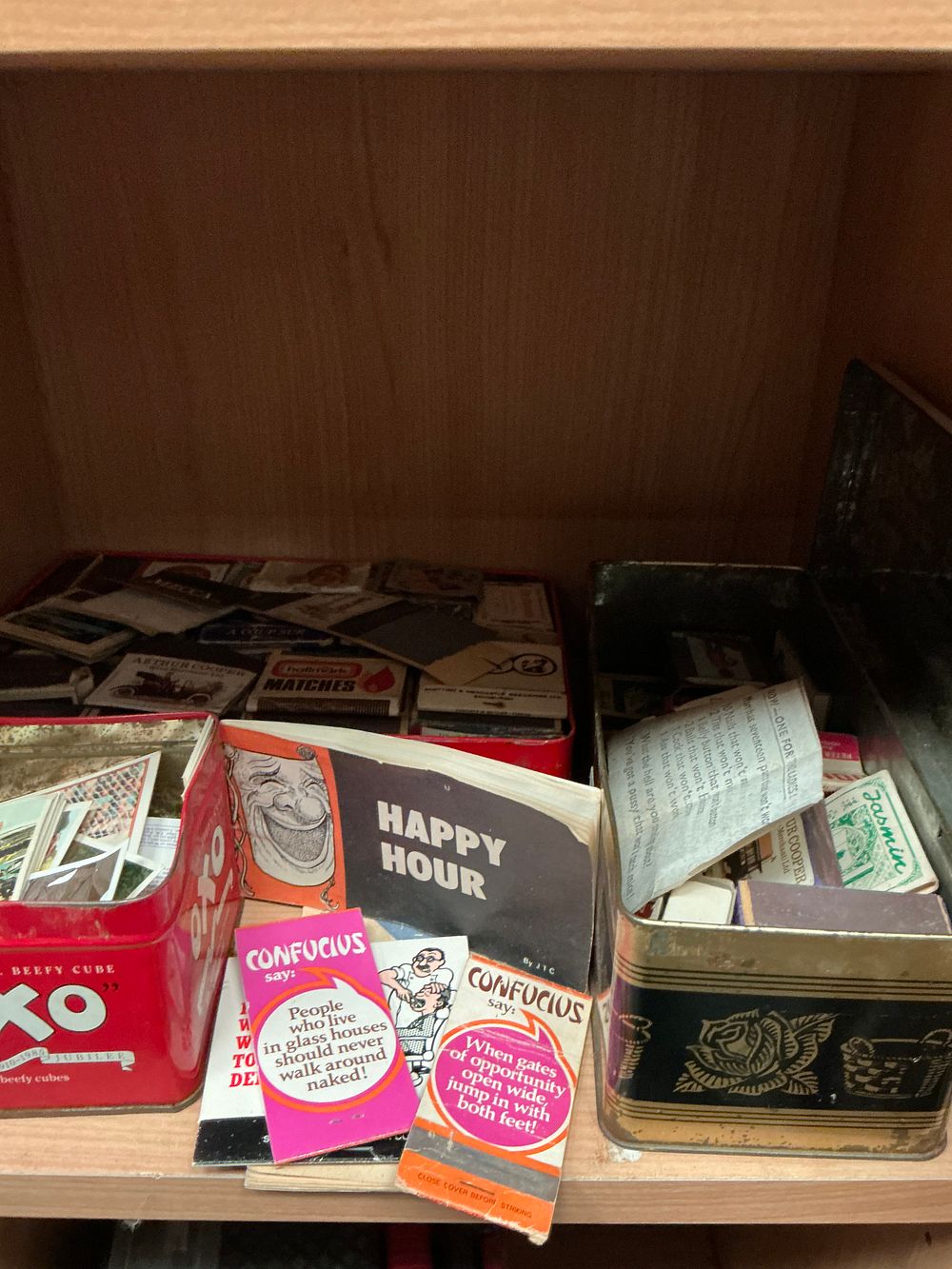Lot 179: An Assortment of Mid-20th-Century Matchboxes, Matchbooks, and Ephemera in Vintage Advertising Tins