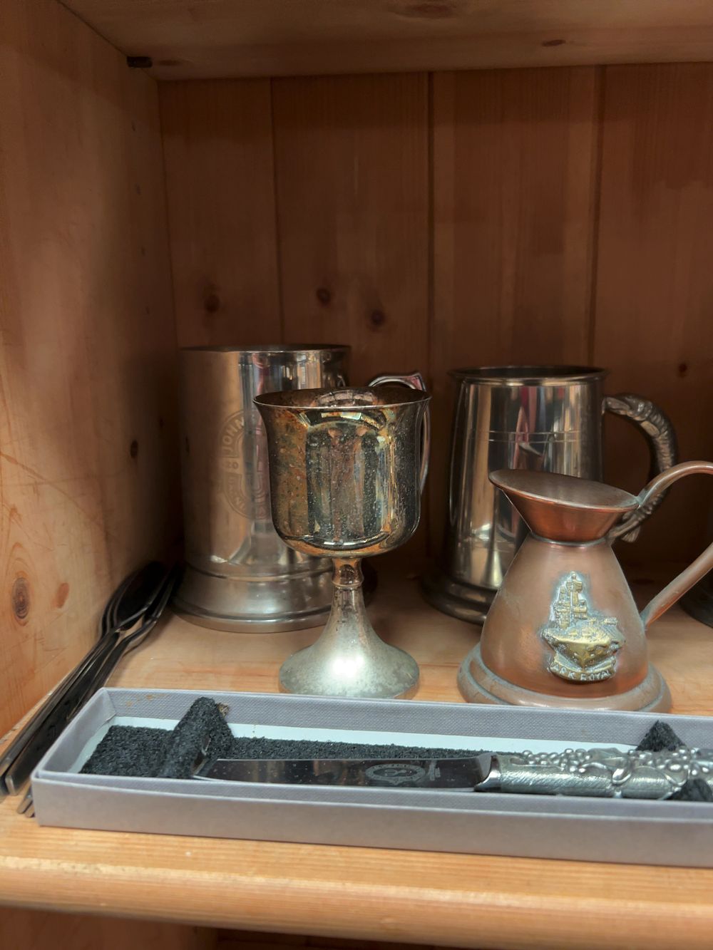 Lot 185: An Assortment of Decorative Metalware including Pewter Tankards, Silver-Plated Holloware, and an Ark Royal Commemorative Measure