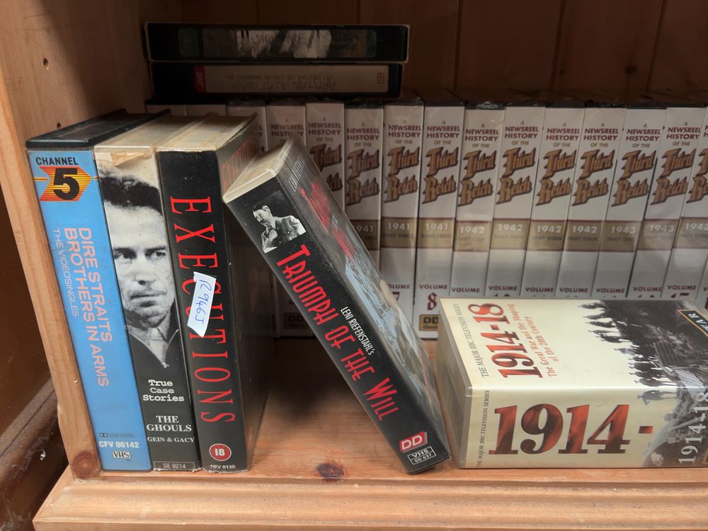 Lot 187: A collection of approximately 25 VHS video cassettes and a Philips DVD/VCR combination player