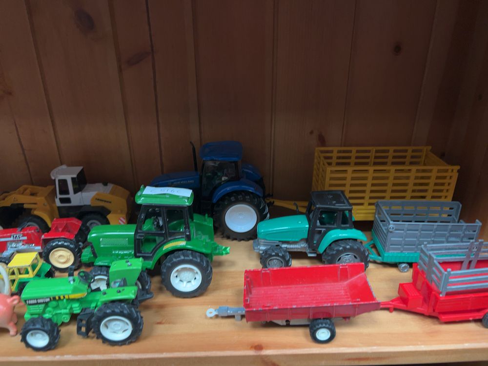 Lot 190: A Collection of Toy Farm Animals and Agricultural Vehicles including a Liebherr Loader
