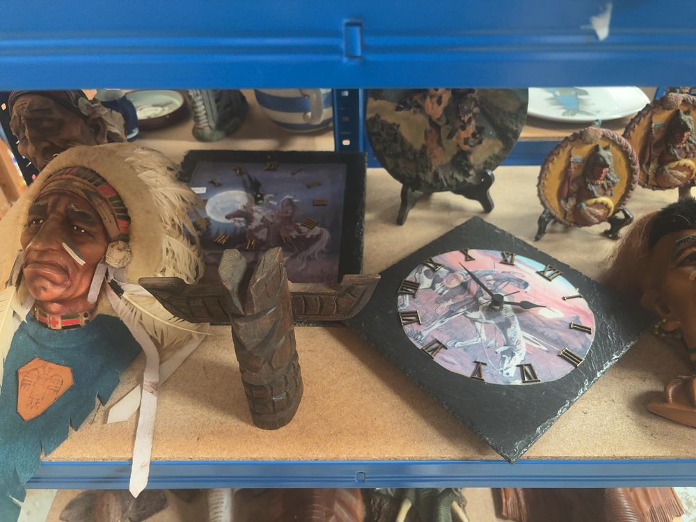 Lot 233: A Collection of Native American-Themed Decorative Items including Resin Busts and Slate Clocks