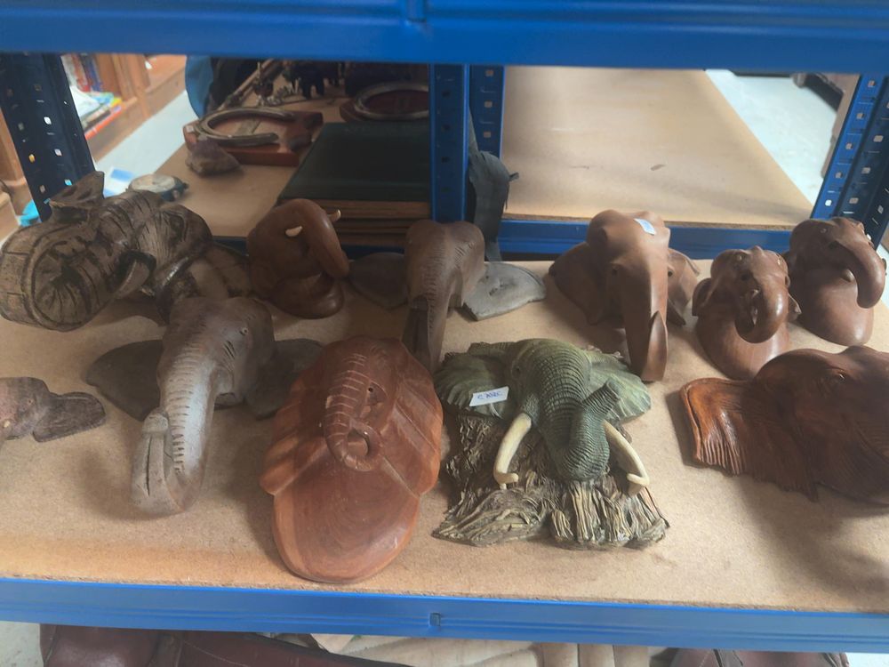 Lot 234: A Collection of Thai Hand-Carved Teak and Composite Elephant Wall Plaques and Sculptures