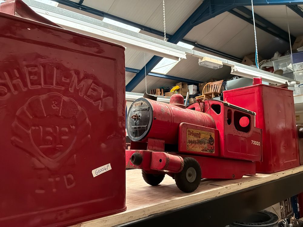 Lot 243: Tri-ang Puff-Puff 73000 Toy Locomotive and a Collection of Vintage Petrol Cans
