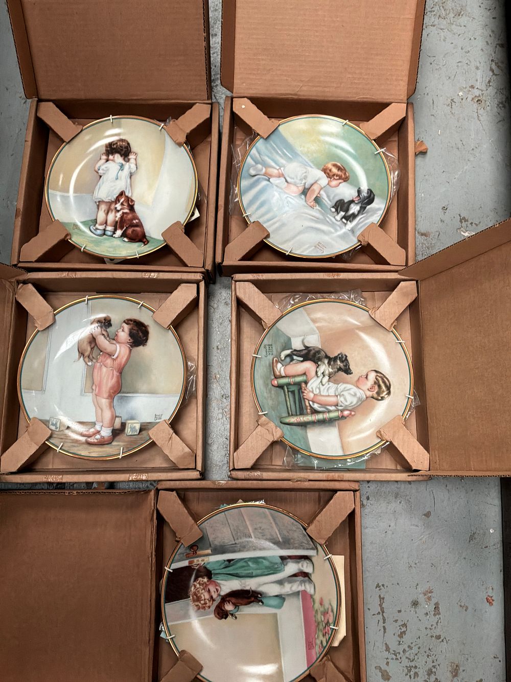Lot 287: A Set of Eight The Hamilton Collection A Child's Best Friend Porcelain Plates after Bessie Pease Gutmann