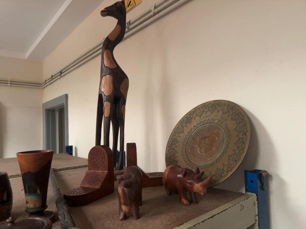 Lot 298: A Collection of Mid-20th Century Wood and Metal Souvenir Objects from Africa, the Caribbean, and Iran