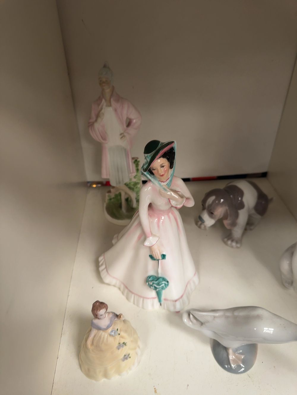 Lot 310: A Collection of Six Porcelain Figurines by Royal Doulton, Coalport, and Lladro