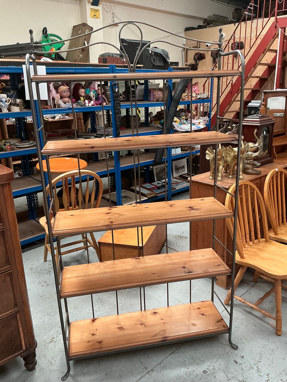 Lot 334: A Ducal pine and metal four-tier baker's rack shelving unit