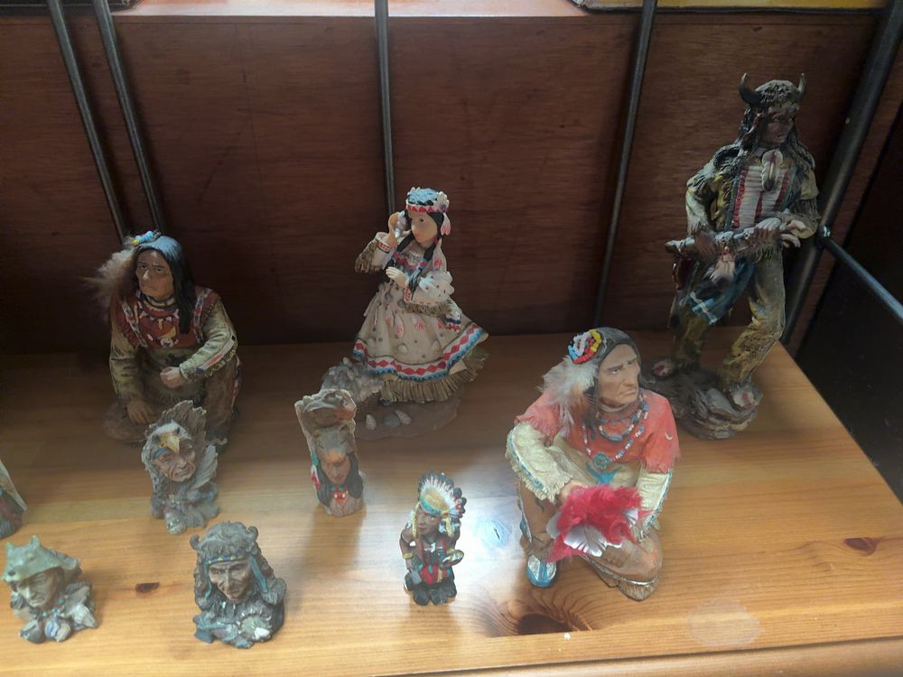 Lot 336: A Collection of thirteen Native American themed cast resin figurines and busts