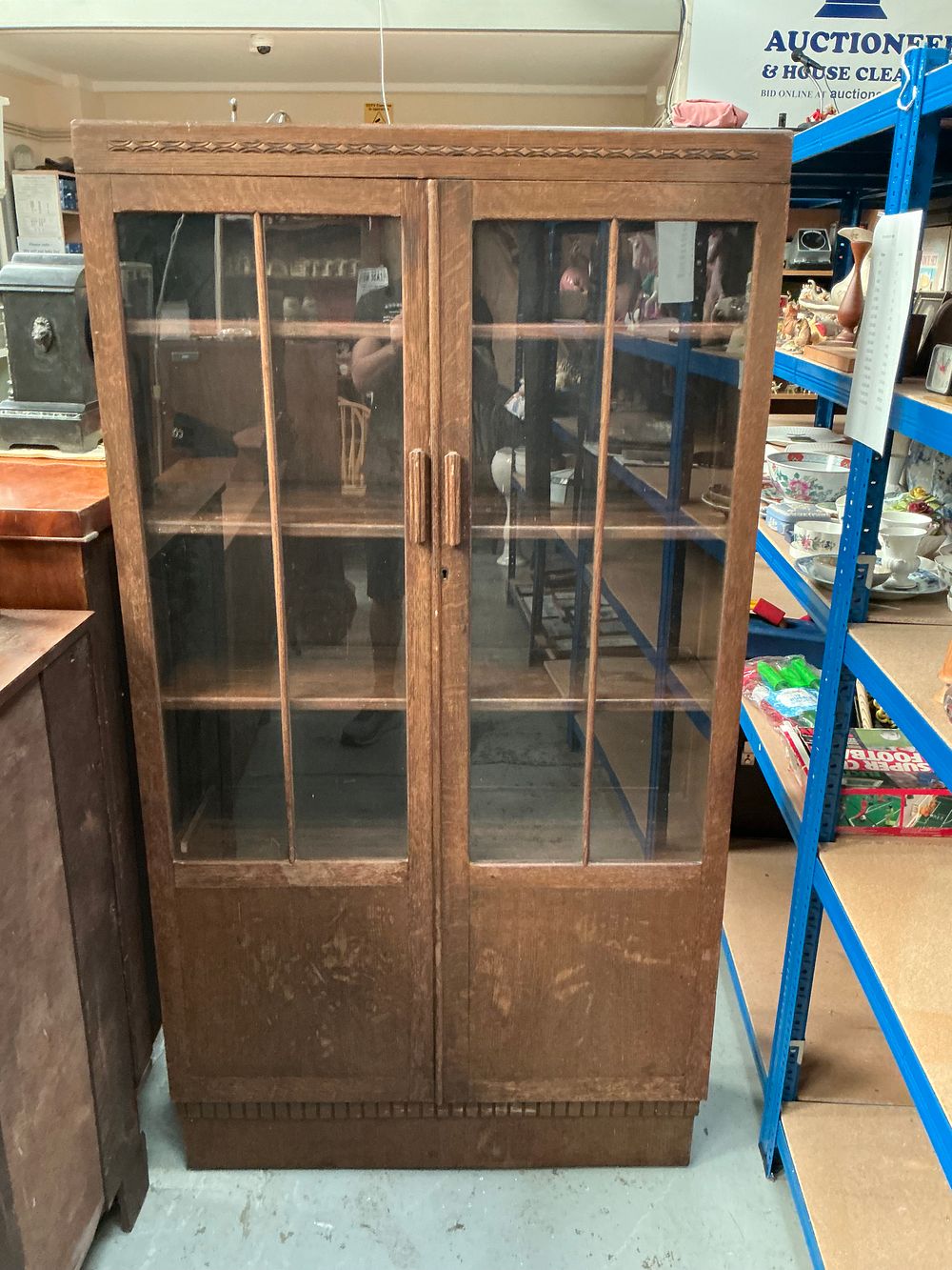 Lot 338: A Mid-20th-Century Oak Two-Door Glazed Bookcase
