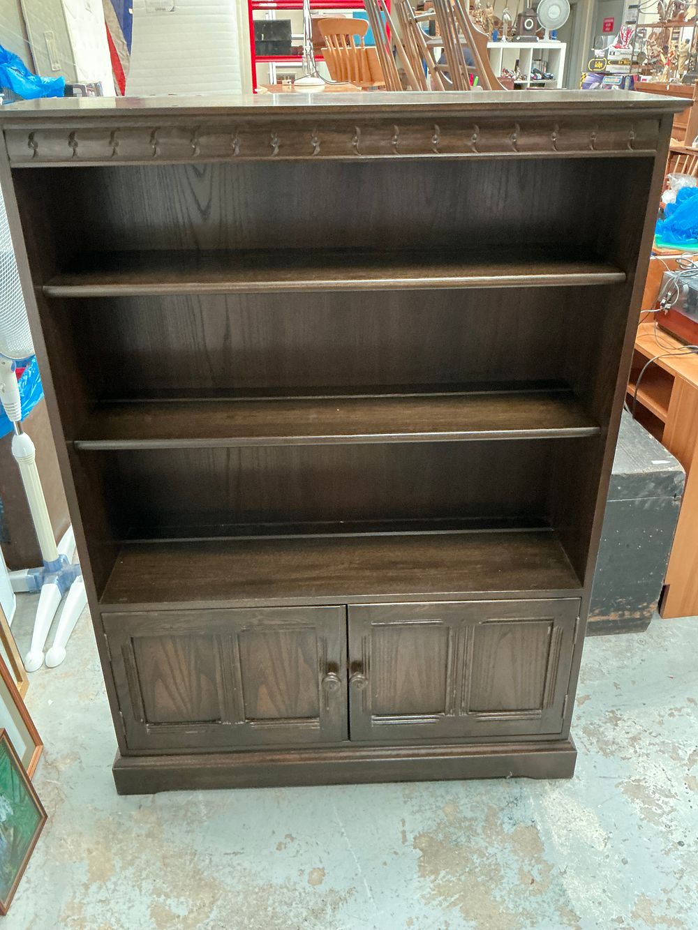 Lot 340: Ercol Design 723 Traditional Finish Open Bookcase with Cupboard Base