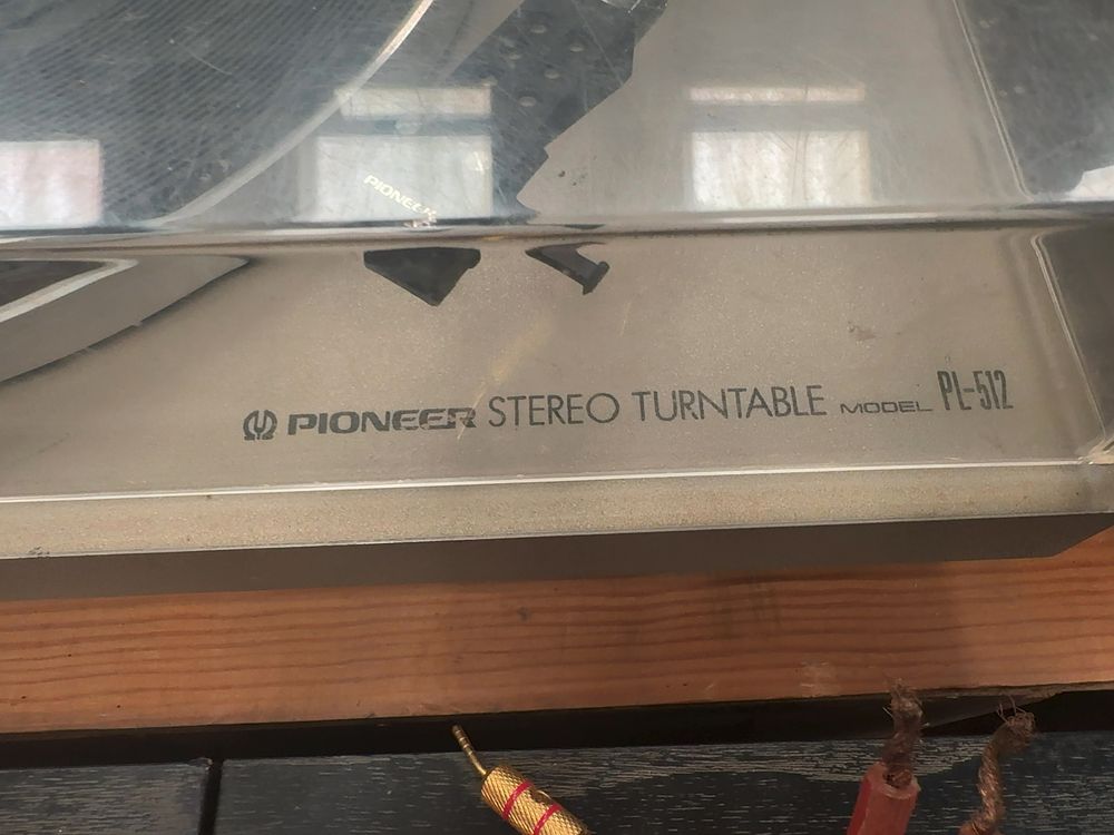 Lot 345: A Pioneer PL-512 Stereo Turntable with Original Operating Instructions and Pioneer SX-690 Schematic Manual