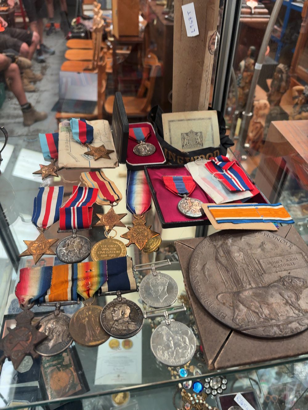 Lot 356: A Group of British World War I, World War II, and Long Service Medals, with Memorial Plaque and Naval Ephemera