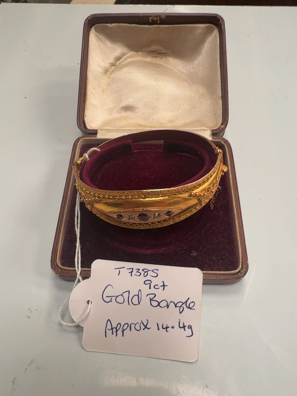 Lot 364: Victorian 9 Carat Gold Etruscan Revival Hinged Bangle