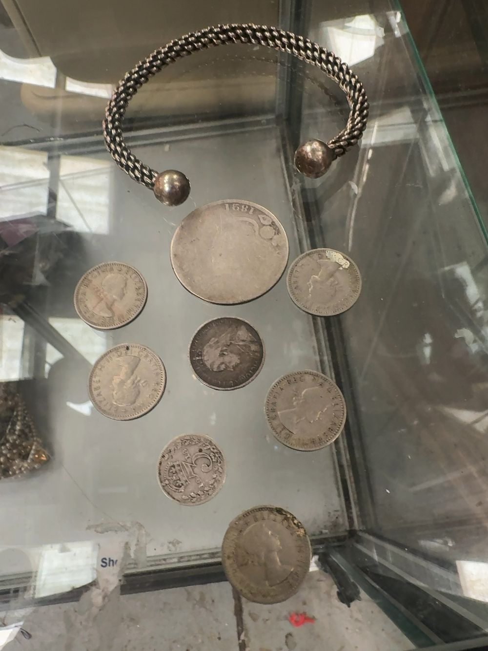 Lot 370: A Collection of US and UK Coins and a White Metal Torque Bracelet