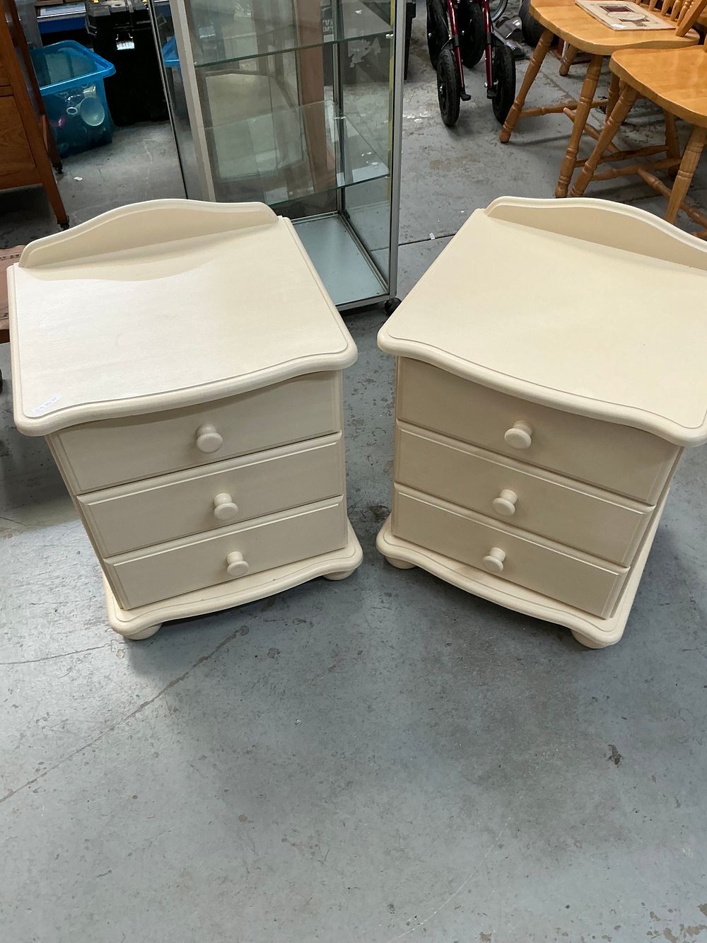 Lot 377: A Pair of Contemporary Cream Painted Three-Drawer Bedside Chests