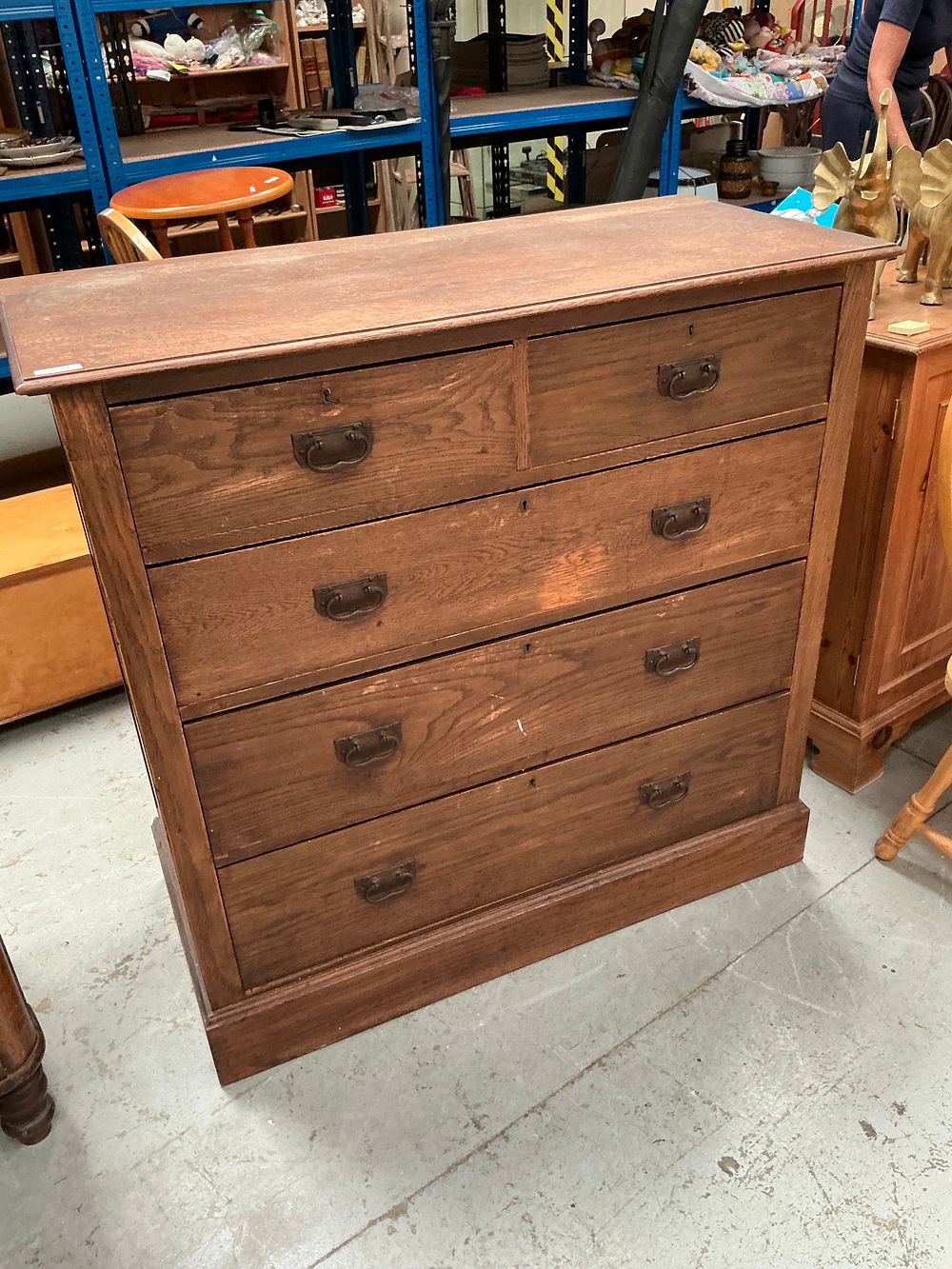 Lot 389: An Edwardian Arts and Crafts Oak Chest of Drawers