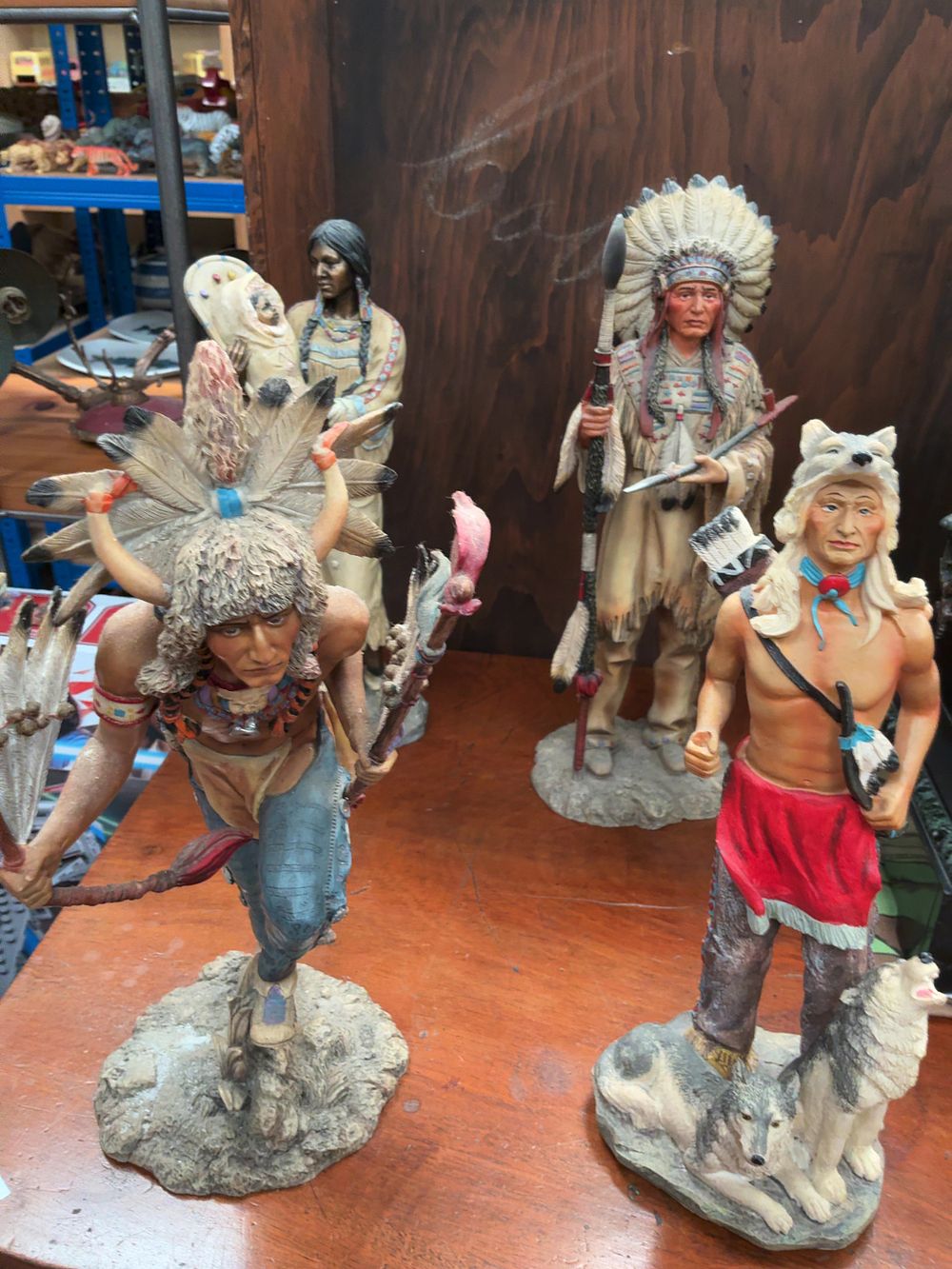 Lot 392: Four Leonardo Collection and Regency Fine Arts Native American Polychrome Figurines