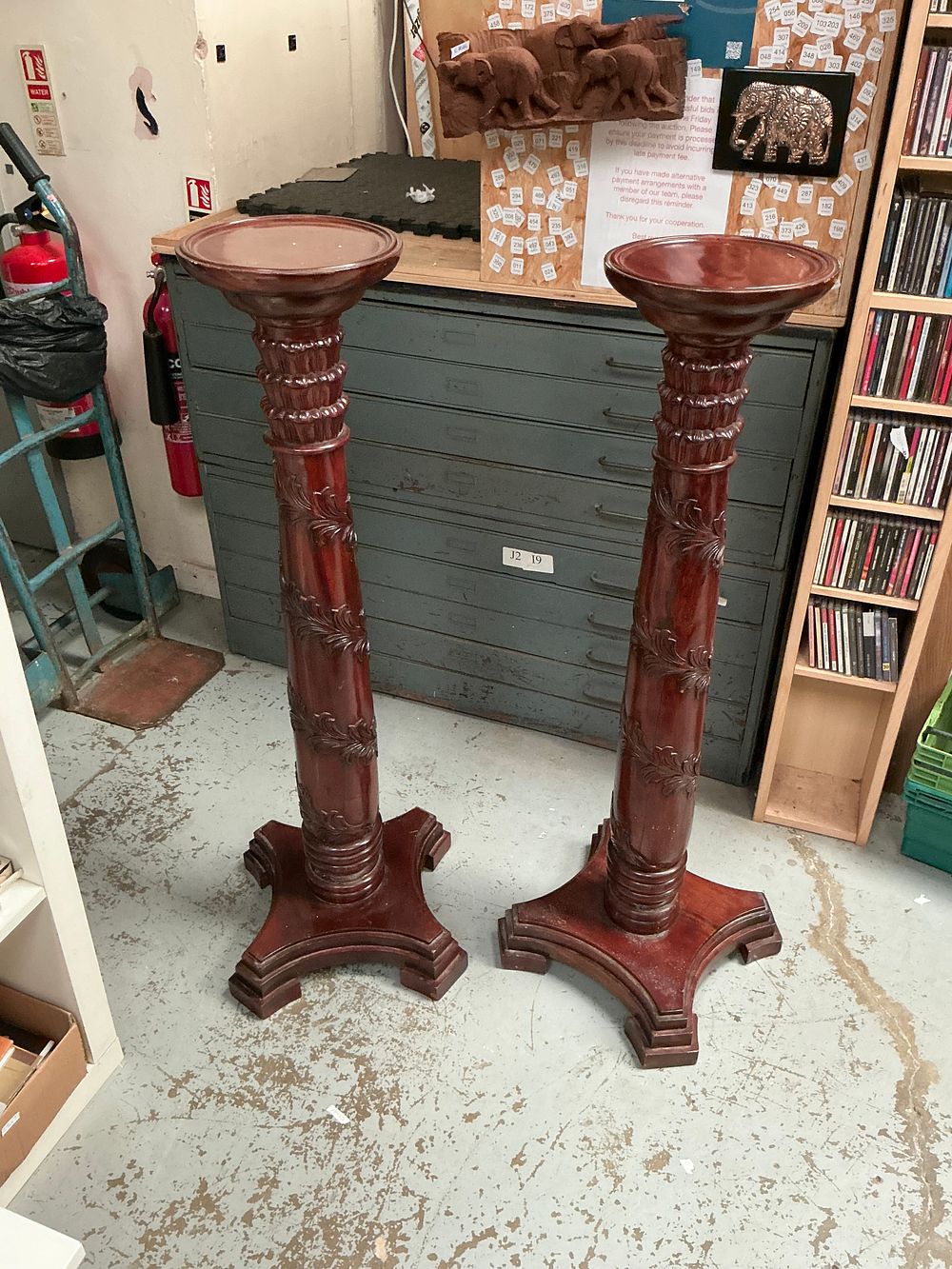 Lot 402: A Pair of Tall Carved Mahogany Pedestals