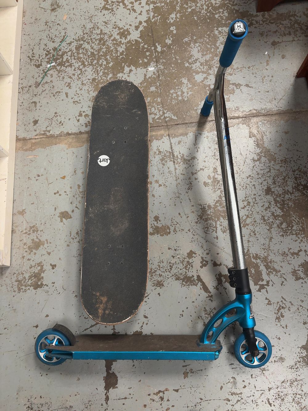 Lot 410: Two wheeled transport items comprising a Santa Cruz skateboard and an MGP stunt scooter