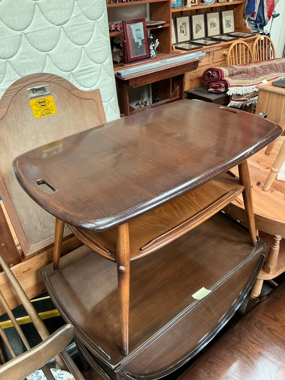 Lot 447: An Ercol Dark Elm Two-Tier Coffee Table