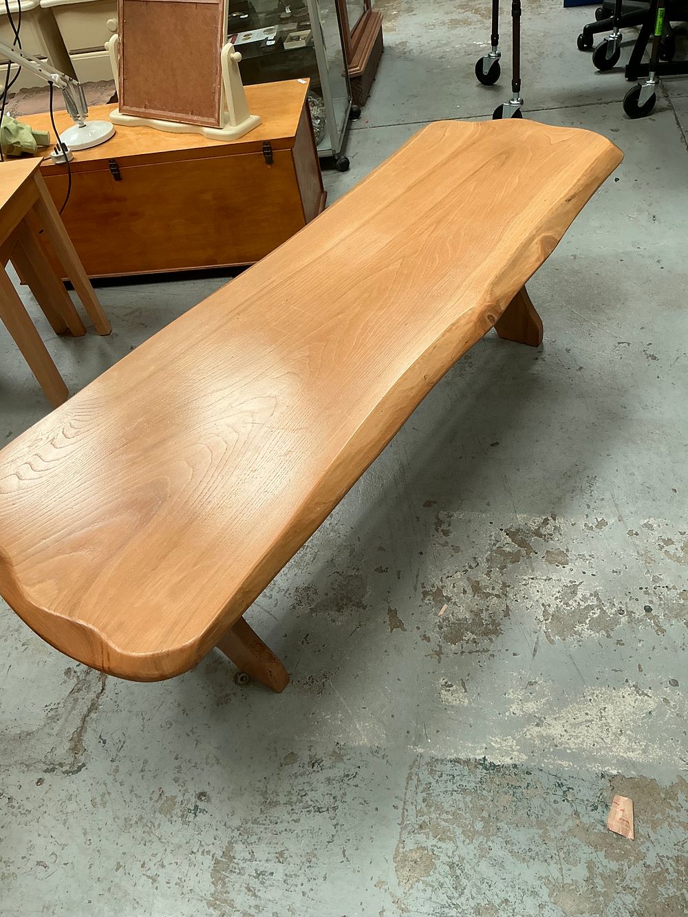 Lot 464: A John Trippas Solid Elm Live-Edge Trestle Coffee Table.
