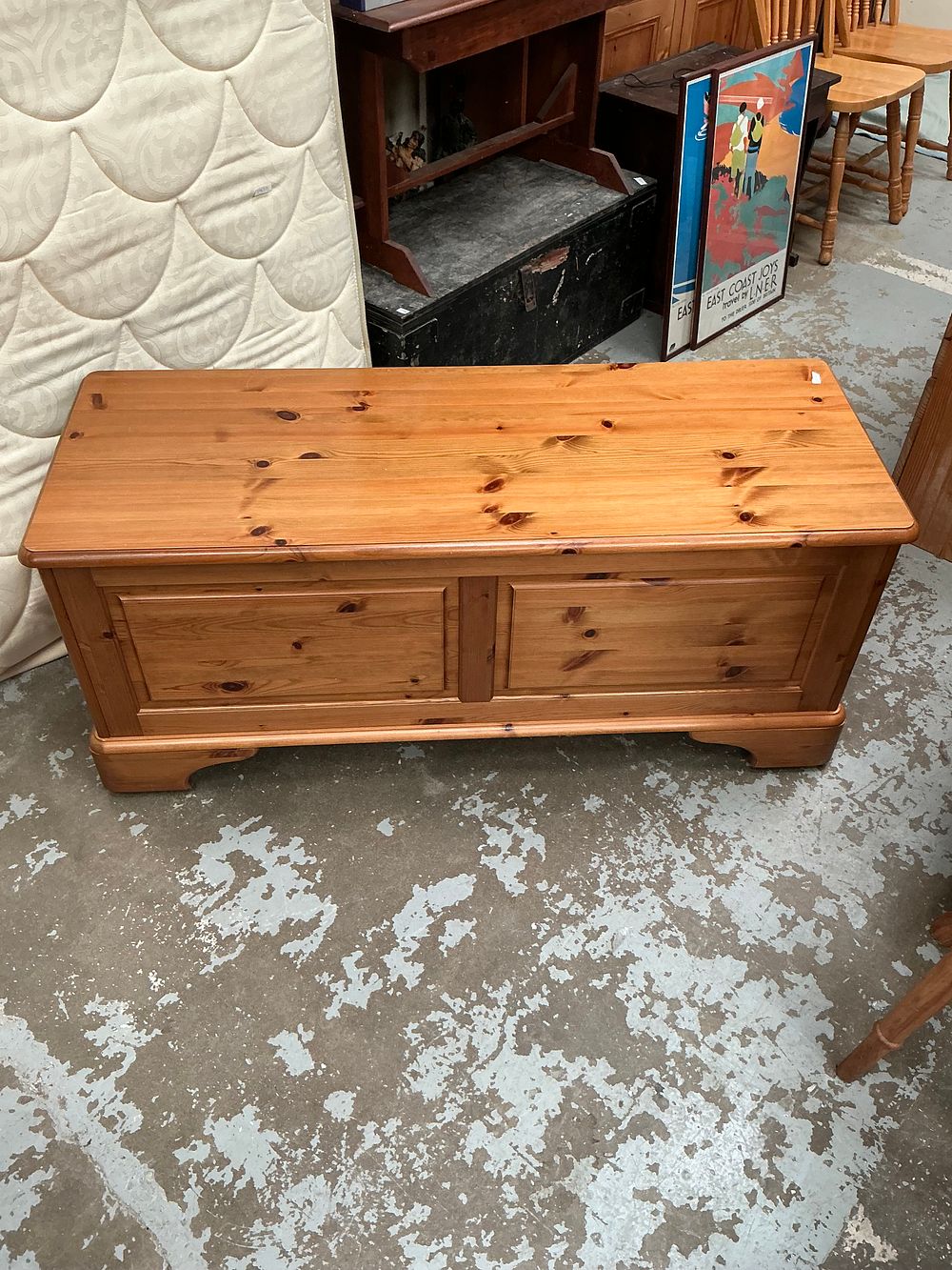 Lot 471: A Ducal solid knotty pine blanket chest with sliding internal trays
