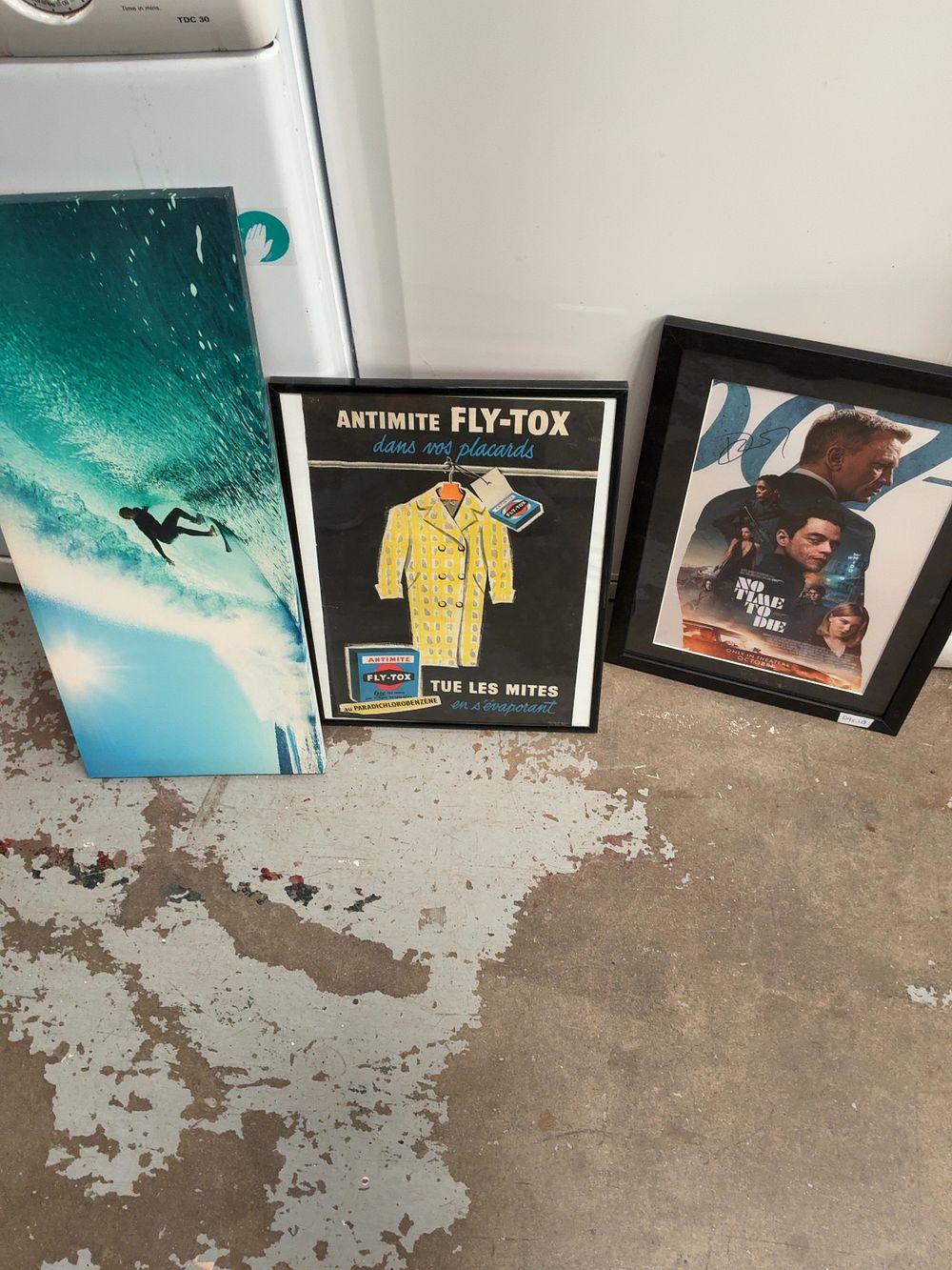 Lot 264: A Trio of Wall Art Items Including a No Time To Die Movie Poster and a Fly-Tox French Advertisement