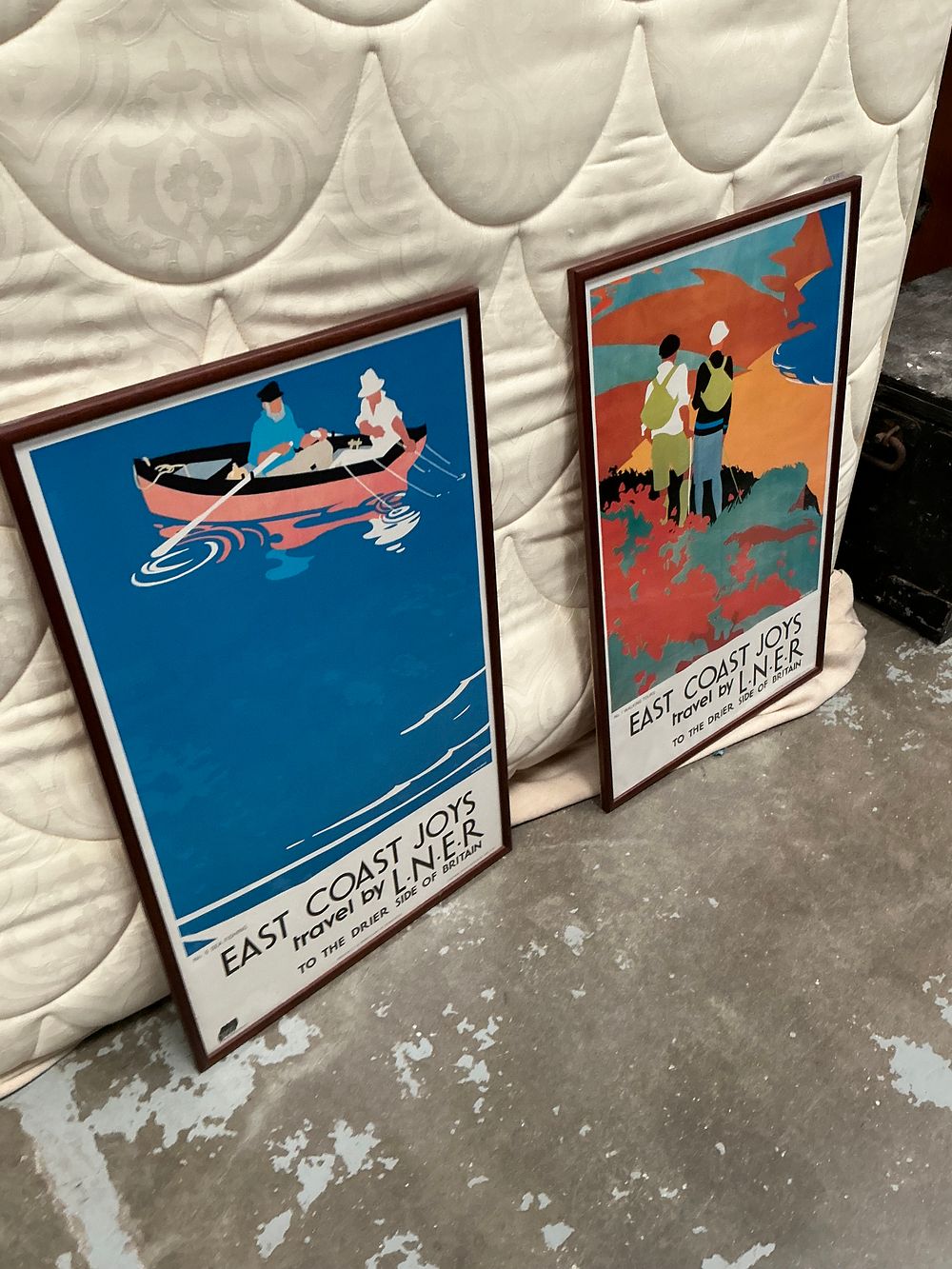 Lot 495: A Pair of Framed National Railway Museum Reproduction LNER East Coast Joys Posters by Tom Purvis