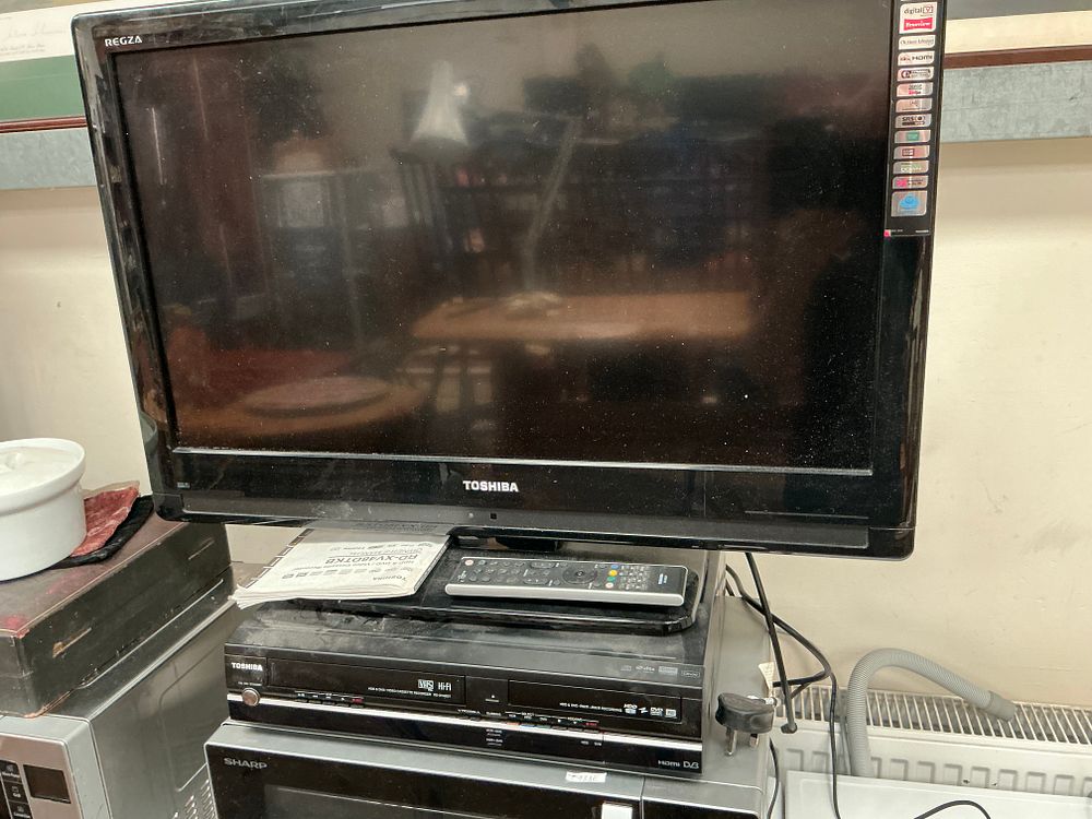 Lot 498: Two Toshiba Electronics Units comprising a 32 Inch HD Ready LCD Television and a Triple-Deck Media Recorder