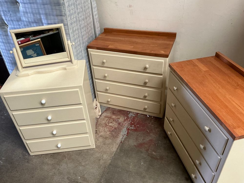 Lot 523: A Trio of Contemporary Cream Painted Bedroom Chests including a Dressing Chest and Two Matching Four-Drawer Chests with Natural Wood Tops
