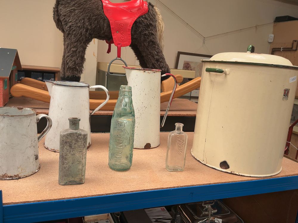Lot 170: A Collection of Vintage Enamelware and Antique Glass Bottles