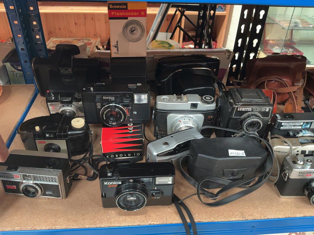 Lot 177: A Collection of Vintage Film Cameras and Photographic Accessories including Konica, Ricoh, LOMO and Kodak