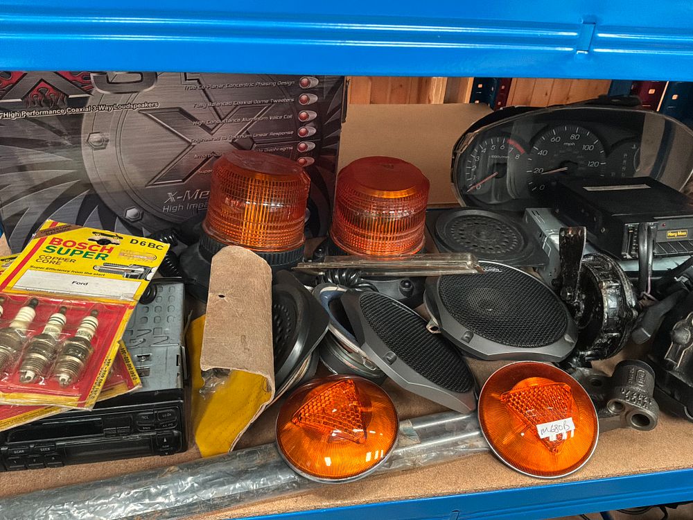 Lot 191: A Collection of Vintage Automotive Parts and Accessories including Bosch, Lucas, and Audioline Components