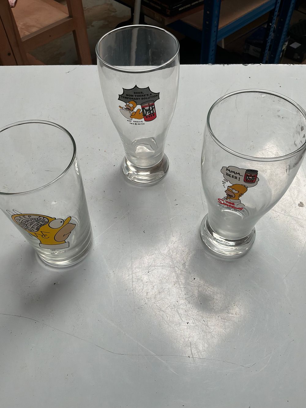 Lot 208: A Trio of Vintage The Simpsons Licensed Drinking Glasses Featuring Homer Simpson
