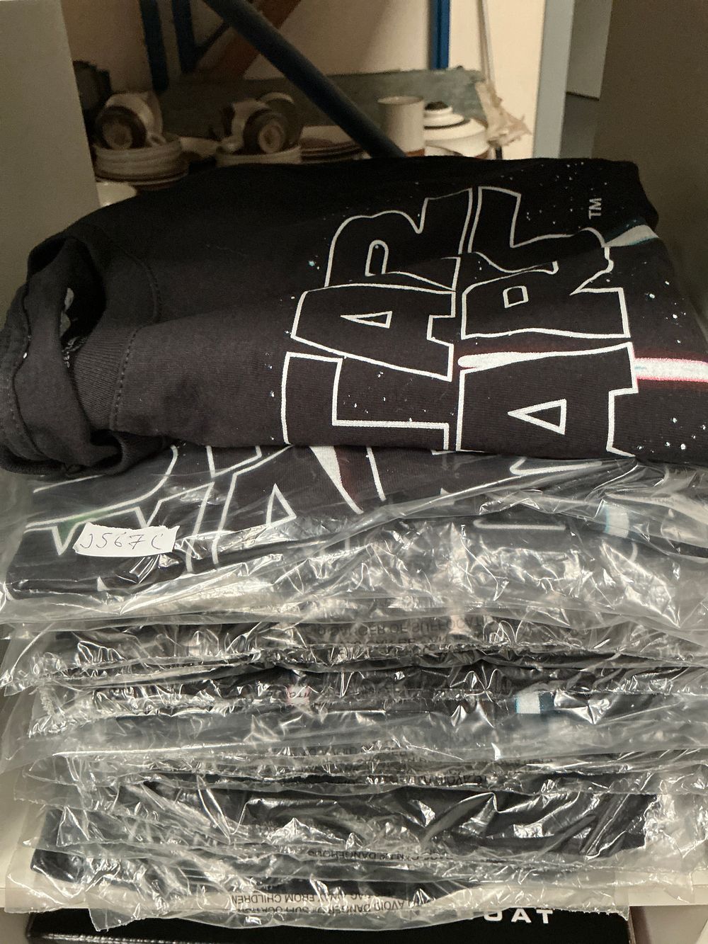 Lot 218: A Collection of Approximately Twenty Six Star Wars Lightsaber Graphic T-Shirts