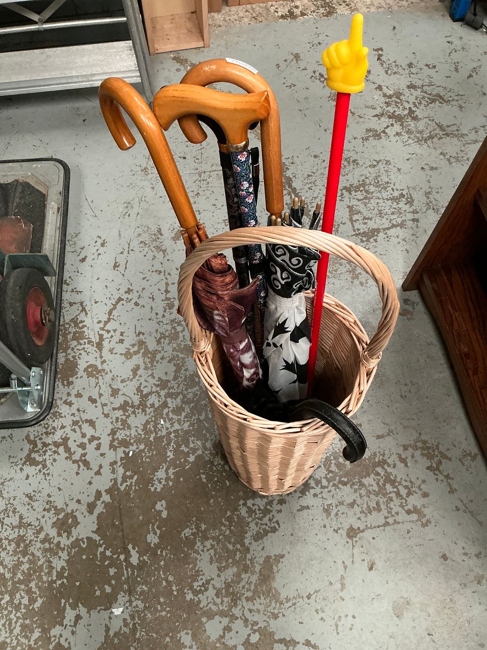 Lot 227: An Assortment of Walking Sticks and Umbrellas with a Wicker Umbrella Stand