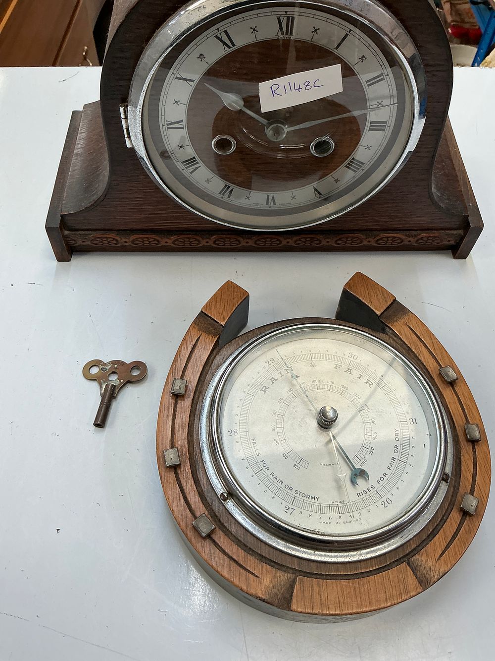 Lot 239: An Enfield Oak Mantel Clock and a Coordinating Horseshoe Aneroid Wall Barometer