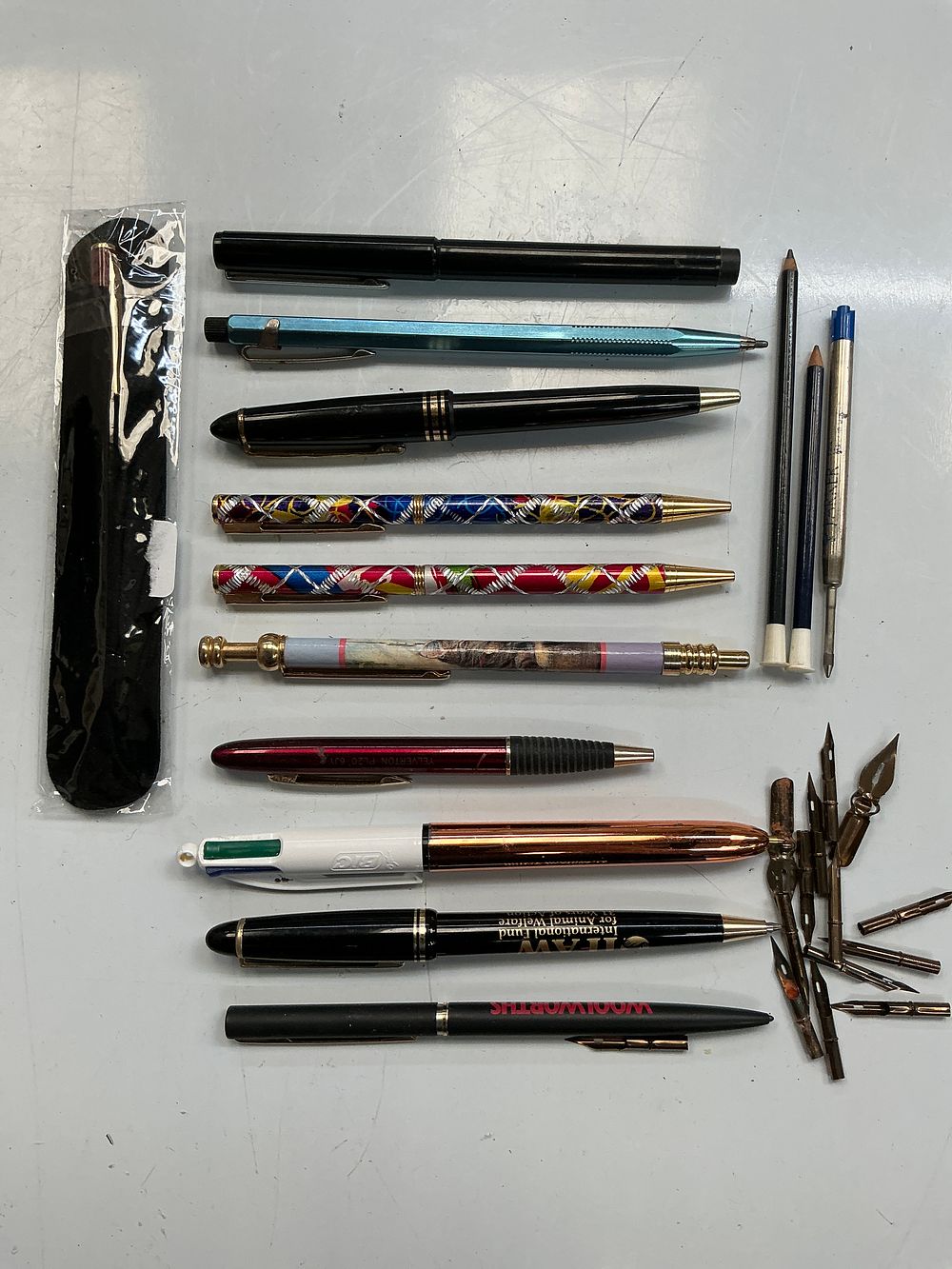 Lot 244: A Collection of Writing Instruments and Desk Accessories.