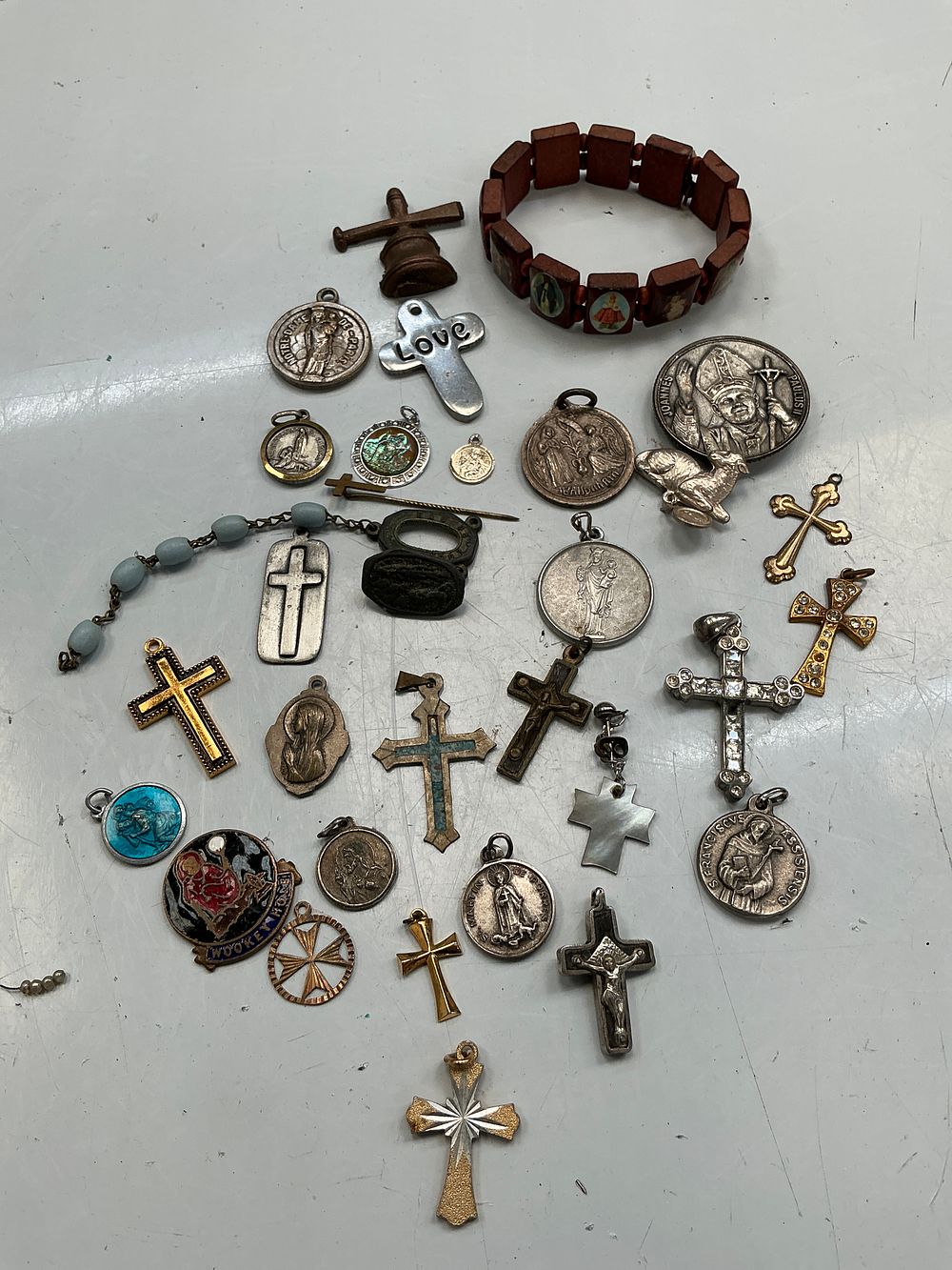 Lot 257: A Collection of Vintage Catholic Religious Medals, Pendants, and Devotional Jewellery