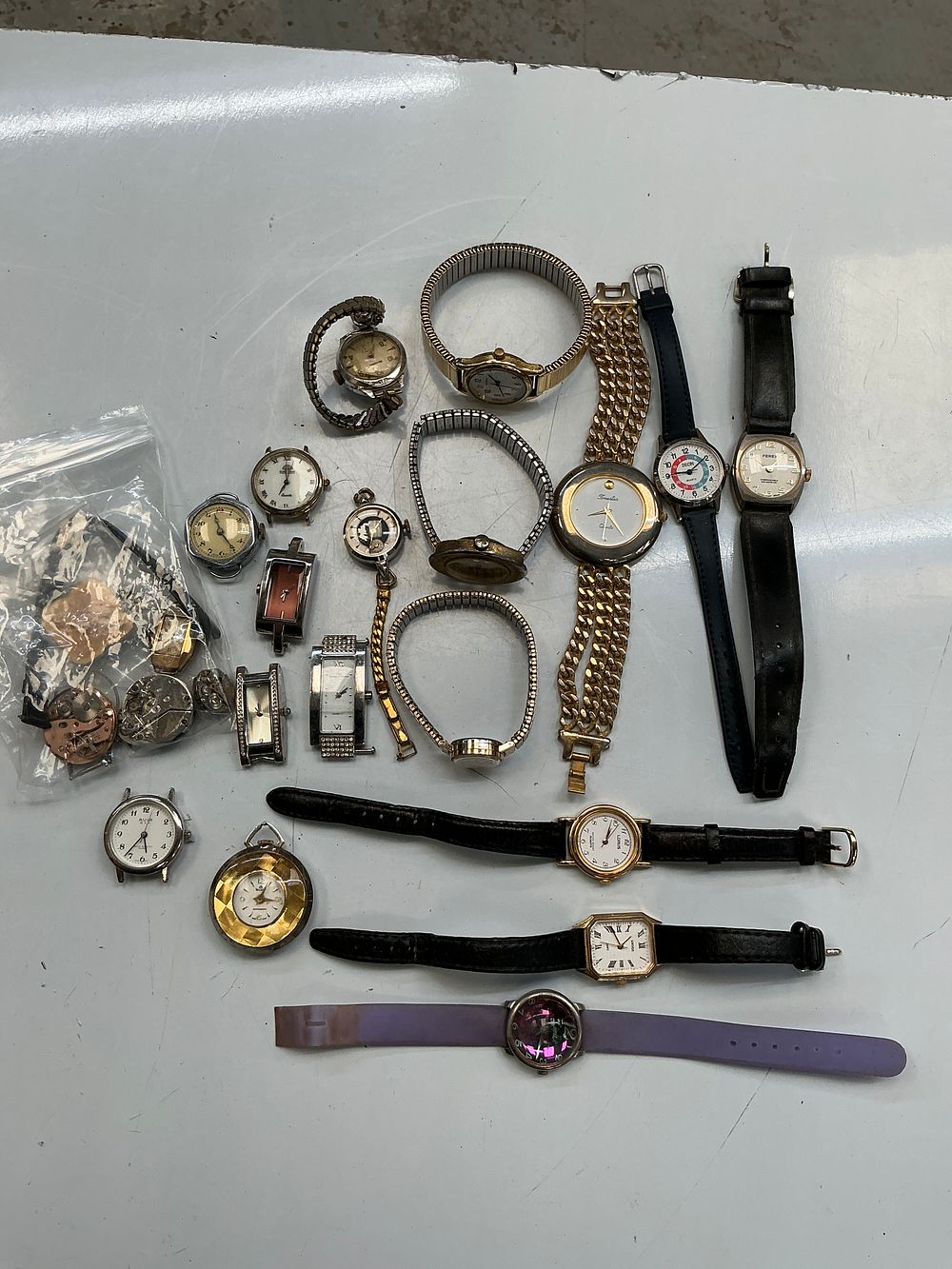 Lot 258: A Collection of Approximately 18 Vintage and Modern Wristwatches, Watch Heads, and Movements including Lorus, Sekonda, and Ferex
